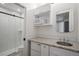 The bathroom features an elegant granite counter, and a glass shower stall at 3618 Navajo St, Denver, CO 80211