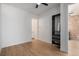 This bedroom features wood floors and access to a bathroom at 3618 Navajo St, Denver, CO 80211