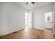 A bright bedroom features wood floors, white walls, and an ensuite bathroom at 3618 Navajo St, Denver, CO 80211