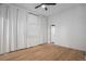 Bright bedroom with wood floors, ceiling fan, and window with light curtains at 3618 Navajo St, Denver, CO 80211