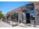 A commercial building with brick and stone facade, featuring an outdoor patio at 3618 Navajo St, Denver, CO 80211