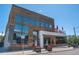 Modern two-story building featuring wood siding and large windows at 3618 Navajo St, Denver, CO 80211
