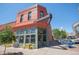 Corner building with vibrant exterior and outdoor seating on a sunny day at 3618 Navajo St, Denver, CO 80211