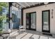 Welcoming front porch with stylish seating and modern black framed doors at 3618 Navajo St, Denver, CO 80211