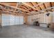 Spacious garage with an unfinished interior and an overhead door at 3618 Navajo St, Denver, CO 80211