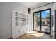 Bright kitchen with large pantry and an open view of the landscaped backyard and outdoor patio at 3618 Navajo St, Denver, CO 80211