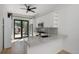 Well-lit kitchen with granite countertops, stainless steel appliances, and stylish fixtures at 3618 Navajo St, Denver, CO 80211