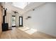 Bright living room with wood floors, a modern fireplace, and a view to the outdoors at 3618 Navajo St, Denver, CO 80211