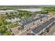 Aerial view of the community with lake and mountain views at 3458 W 63Rd Ave, Denver, CO 80221