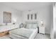 Comfortable bedroom featuring soft natural light and minimalist modern decor at 3458 W 63Rd Ave, Denver, CO 80221