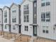 Charming townhomes featuring modern facades, complemented by well-maintained landscaping and inviting entryways at 3458 W 63Rd Ave, Denver, CO 80221