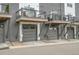 View of garages featuring balconies and modern architecture at 3458 W 63Rd Ave, Denver, CO 80221