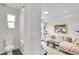 Bright living room with neutral colors, a cozy sectional, stylish rug and modern art; a serene and inviting space at 3458 W 63Rd Ave, Denver, CO 80221