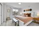 Bright and airy main bedroom with a comfortable bed, stylish decor, and ample natural light at 3458 W 63Rd Ave, Denver, CO 80221