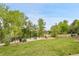Neighborhood park featuring lush green space, picnic tables, and playground elements, perfect for community enjoyment at 3458 W 63Rd Ave, Denver, CO 80221