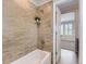 Bathroom featuring a tiled shower and a neutral color palate at 10045 Copenhagen St, Parker, CO 80134