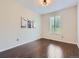 Bright bedroom with hardwood floors, shuttered windows, and neutral decor, creating a serene atmosphere at 10045 Copenhagen St, Parker, CO 80134