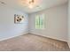 Bright bedroom featuring neutral walls, carpet flooring, and a ceiling fan with light at 10045 Copenhagen St, Parker, CO 80134