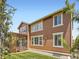Exterior view of home, showing wooden siding and pergola-covered deck at 10045 Copenhagen St, Parker, CO 80134