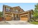 Charming two-story home featuring a three-car garage, brick accents, and a well-manicured front yard at 10045 Copenhagen St, Parker, CO 80134