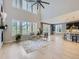 Bright living room featuring hardwood floors, large windows with shutters, and access to the kitchen at 10045 Copenhagen St, Parker, CO 80134