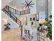 Spacious living room with a stone fireplace, hardwood floors, and a staircase to the second floor at 10045 Copenhagen St, Parker, CO 80134