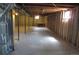 Spacious unfinished basement with exposed ceiling beams and framed walls at 19025 E Bethany Pl, Aurora, CO 80013