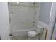 Bright bathroom featuring a tub with white tile surround, shower, and toilet at 19025 E Bethany Pl, Aurora, CO 80013