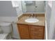 Bathroom vanity with granite countertop, white basin sink and wooden cabinets at 19025 E Bethany Pl, Aurora, CO 80013