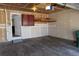 View of garage with a drop ceiling, storage cabinets, and a utility door at 19025 E Bethany Pl, Aurora, CO 80013