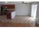 Open kitchen and dining area with tile floors and sliding glass door to outdoor at 19025 E Bethany Pl, Aurora, CO 80013