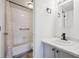 Bathroom features a shower-tub combination with a sleek, modern sink and stylish fixtures at 3141 S Tamarac Dr # 206E, Denver, CO 80231