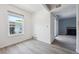 Bright bedroom with modern flooring and balcony access at 3141 S Tamarac Dr # 206E, Denver, CO 80231