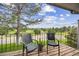 Outdoor balcony with seating offers green views of a golf course at 6513 Pinewood Dr, Parker, CO 80134