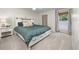 Light filled bedroom features a sliding door headboard with under bed storage at 6513 Pinewood Dr, Parker, CO 80134