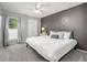 Neutral bedroom with lots of natural light, plush carpeting, and decorative touches at 6513 Pinewood Dr, Parker, CO 80134