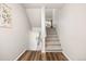 Hallway with a view of the carpeted stairs and decor at 6513 Pinewood Dr, Parker, CO 80134