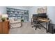 Bright office with a large custom blue built-in bookshelf at 6513 Pinewood Dr, Parker, CO 80134