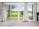 Sliding doors offering stunning golf course views and ample natural light at 6513 Pinewood Dr, Parker, CO 80134