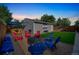 Spacious backyard with a firepit area, lawn, and patio with seating at 3241 Sheridan Blvd, Wheat Ridge, CO 80212