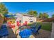 Backyard with a sitting area, firepit, and artificial grass at 3241 Sheridan Blvd, Wheat Ridge, CO 80212