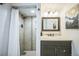 Tiled bathroom with vanity, shower, and stylish fixtures at 3241 Sheridan Blvd, Wheat Ridge, CO 80212