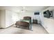 Cozy bedroom with a bed, TV, and storage cabinets at 3241 Sheridan Blvd, Wheat Ridge, CO 80212