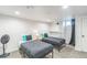 Neutral bedroom with two twin beds, bright lighting, and closet for storage at 3241 Sheridan Blvd, Wheat Ridge, CO 80212