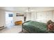 Bedroom featuring a bed, adjacent living space, and storage at 3241 Sheridan Blvd, Wheat Ridge, CO 80212