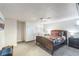 Comfortable bedroom featuring plush carpeting and convenient built-in storage solutions at 3241 Sheridan Blvd, Wheat Ridge, CO 80212