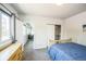 Bedroom featuring a bed, closet and a view into the next room at 3241 Sheridan Blvd, Wheat Ridge, CO 80212