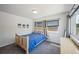 Serene bedroom with neutral tones, cozy carpet and lots of natural light at 3241 Sheridan Blvd, Wheat Ridge, CO 80212