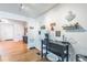 Bright dining area with wood floors and coffee bar features a stylish design at 3241 Sheridan Blvd, Wheat Ridge, CO 80212