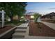 Charming home exterior with a landscaped front yard and a welcoming entrance at 3241 Sheridan Blvd, Wheat Ridge, CO 80212